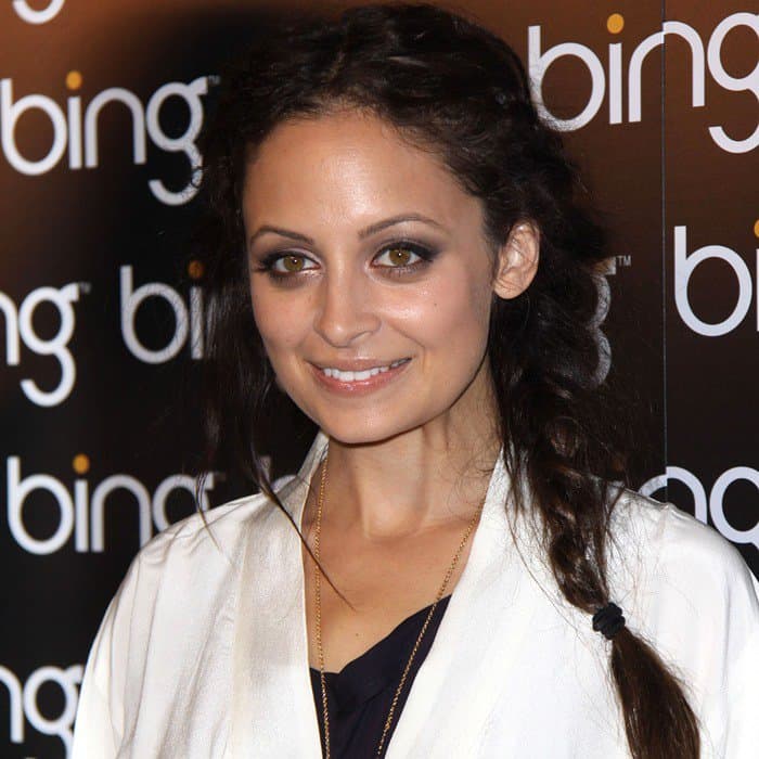 Nicole Richie accessorized with House of Harlow 1960 jewelry and a vintage Pierre Cardin beaded metallic clutch