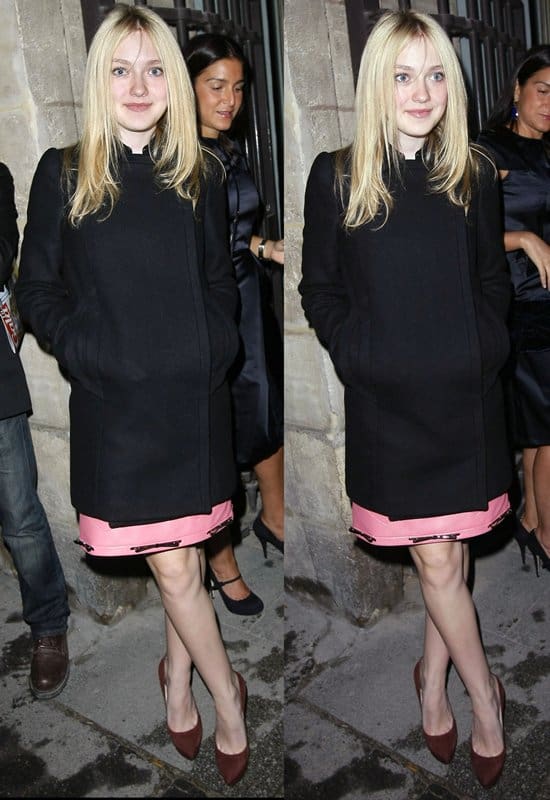 Dakota Fanning wears a pink leather dress, a pink cardigan and purple pumps at the Miu Miu Spring 2011 RTW fashion show in Paris on October 6, 2010