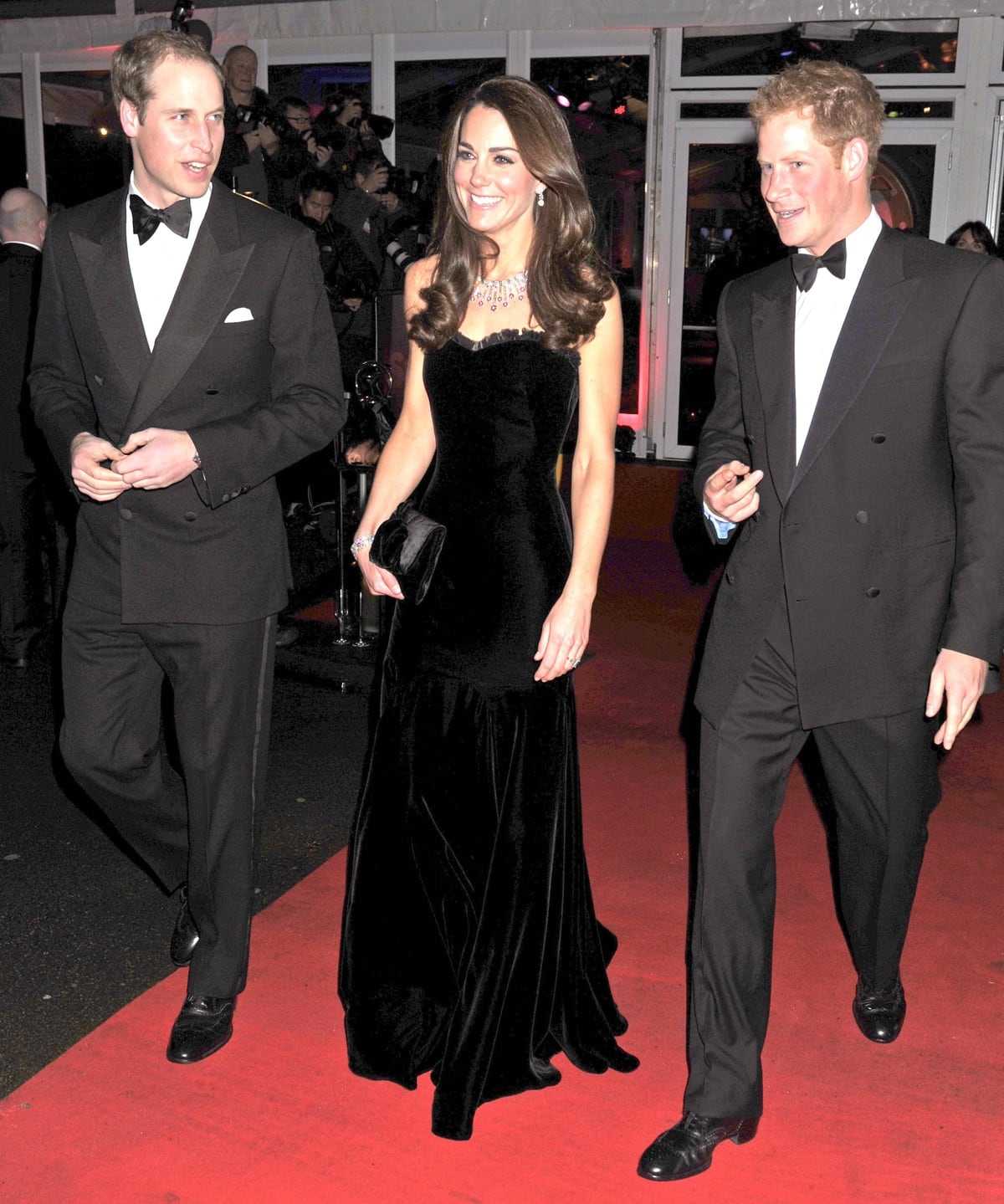Prince William, Duke of Cambridge, Catherine, Duchess of Cambridge, and Prince Harry arrive at the Imperial War Museum for The Sun Military Awards, where British service people are honored, on December 19, 2011, in London, England
