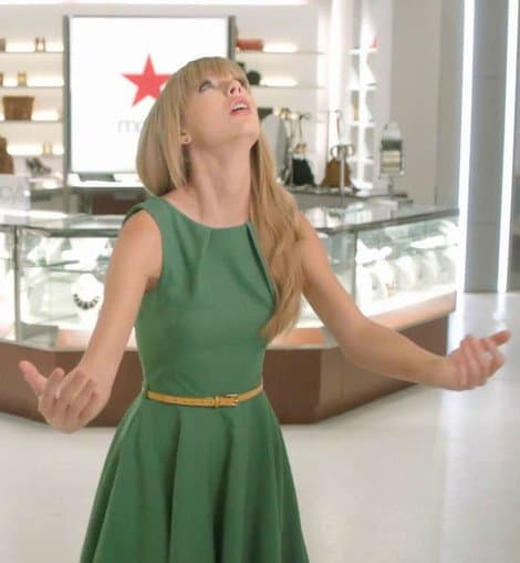 Taylor Swift wears a green pleated green ModCloth dress