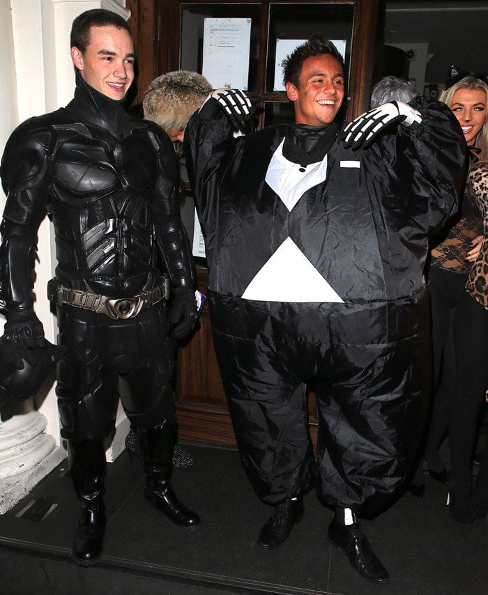 Liam Payne of One Direction dressed as Batman, and Tom Daley in a fat skeleton costume at Funky Buddha nightclub for a Halloween party in London, England on October 28, 2012
