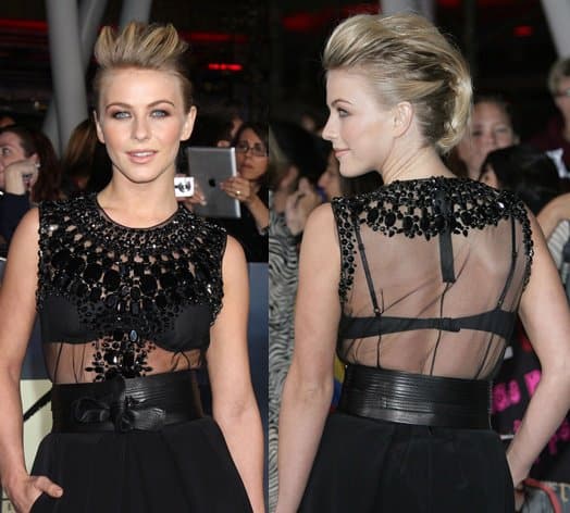 Julianne Hough departed from her usual ladylike style and donned a complex KaufmanFranco ensemble featuring a black see-through cut-out design, embellished collar, leather belt, and a punk-inspired hairstyle