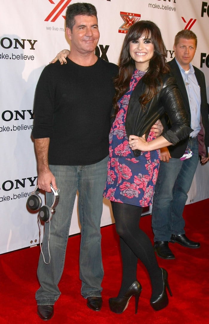 Simon Cowell and Demi Lovato at the X Factor 2012 Final Four Party at Rodeo Drive on December 6, 2012, in Beverly Hills, California