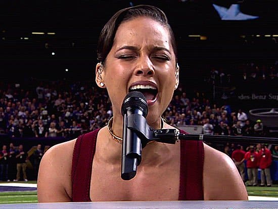 Alicia Keys performs "The Star-Spangled Banner" while playing piano during Super Bowl XLVII
