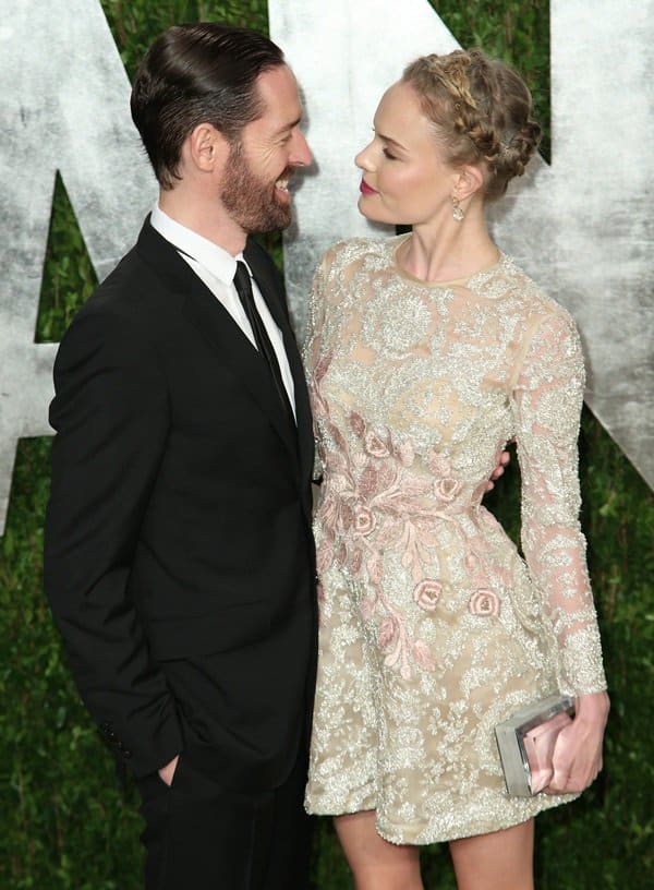 Kate Bosworth in a short dress with her fiance Michael Polish at the 2013 Vanity Fair Oscar Party