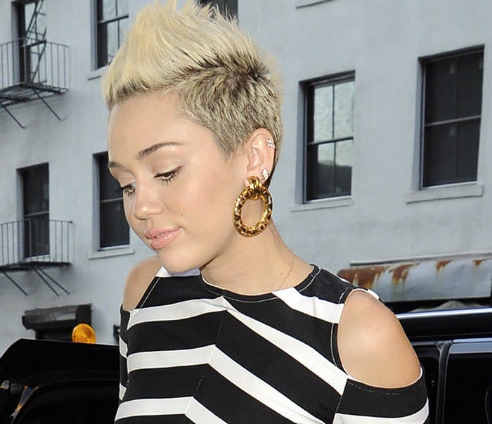 It's no secret that Miley Cyrus has a thing for black and white stripes, and now it seems her love for this classic print is extending to dresses as well
