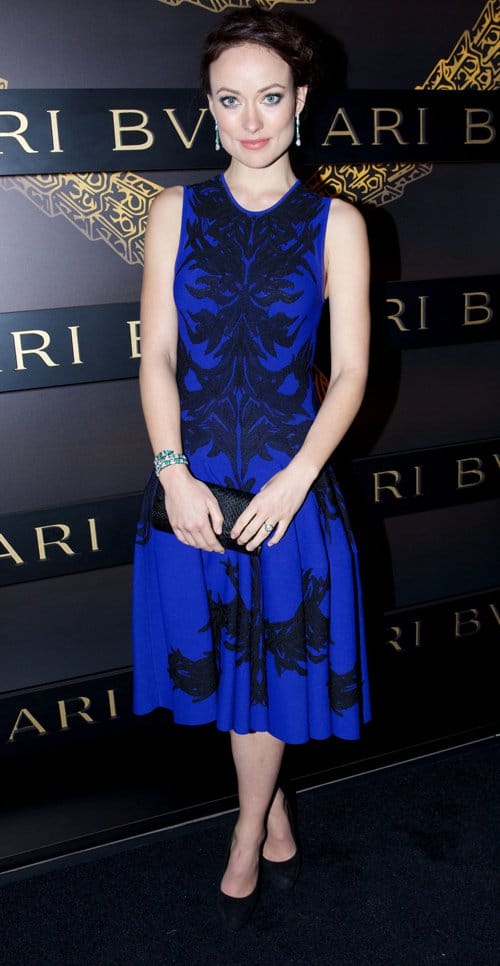 Olivia Wilde wearing an Alexander McQueen dress and heels with Bulgari jewelry at the Bulgari Celebrates Icons Of Style: The Serpenti event during Fall 2013 Fashion Week