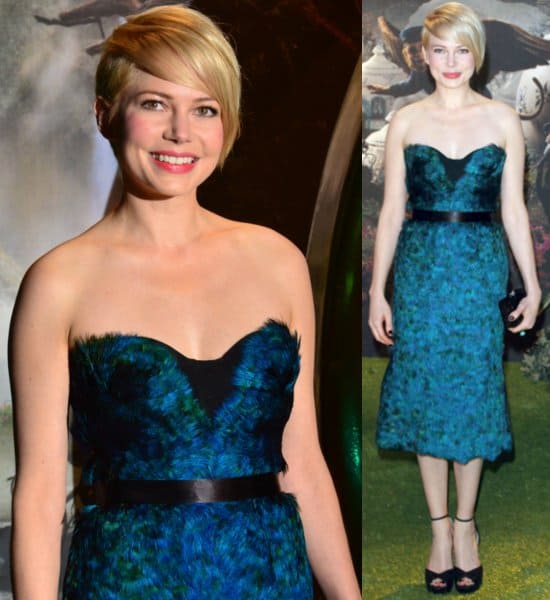 Michelle Williams wears a black belt with a feathered Burberry dress at the UK premiere of 'Oz the Great and Powerful'