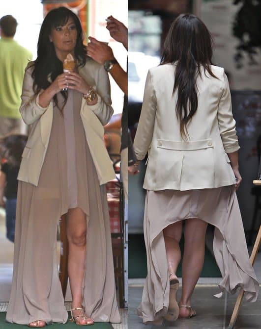 Kim Kardashian styled her nude dress with a Pencey Palm blazer and Giuseppe Zanotti T-strap flat sandals