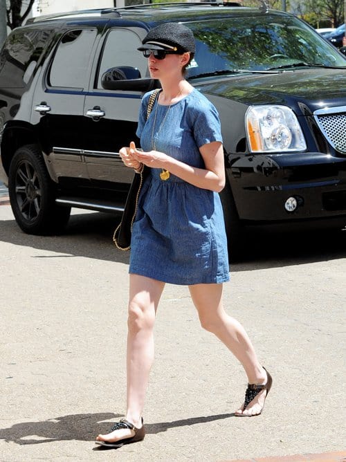 A gently ruched waist creates soft fullness on the skirt of Anne Hathaway's sweet chambray dress