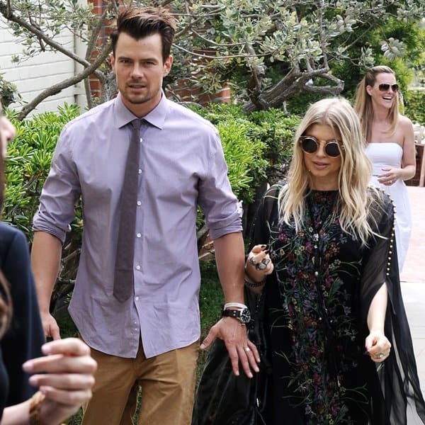 A pregnant Fergie and husband Josh Duhamel leaving a church in Brentwood after Easter Sunday mass