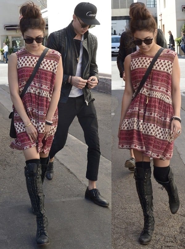Vanessa Hudgens wearing a printed sleeveless frock paired with rugged over-the-knee lace-up boots