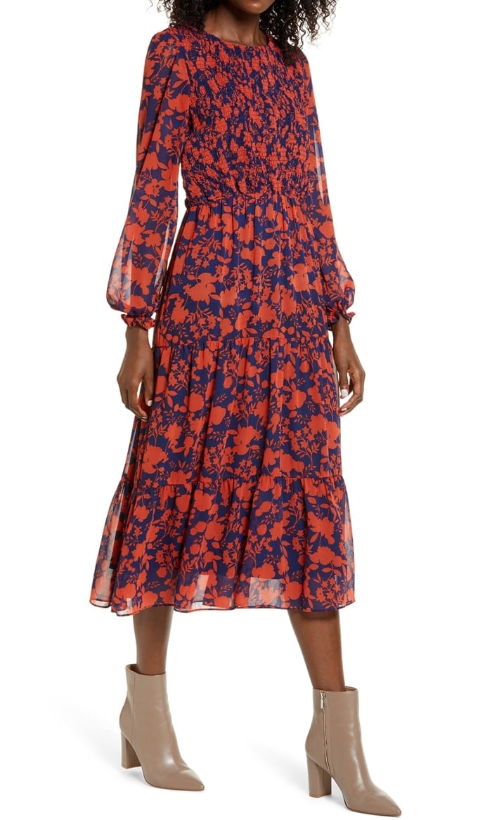 This chiffon midi dress maximizes its impact with a striking floral-silhouette print, sheer sleeves and a smocked bodice that gives way to a flowy tiered skirt.