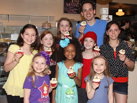 The cast of 'Annie'enjoying the honorary cupcake at Magnolia Bakery in New York City on June 19, 2013