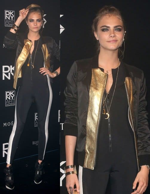 Cara Delevingne wears a striped jumpsuit at the DKNY Artworks launch