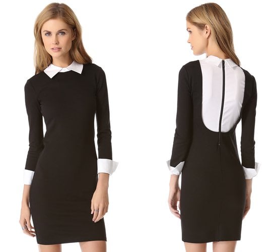 Contrast cuffs and a fold-over collar lend a polished look to a fitted black and white alice + olivia dress