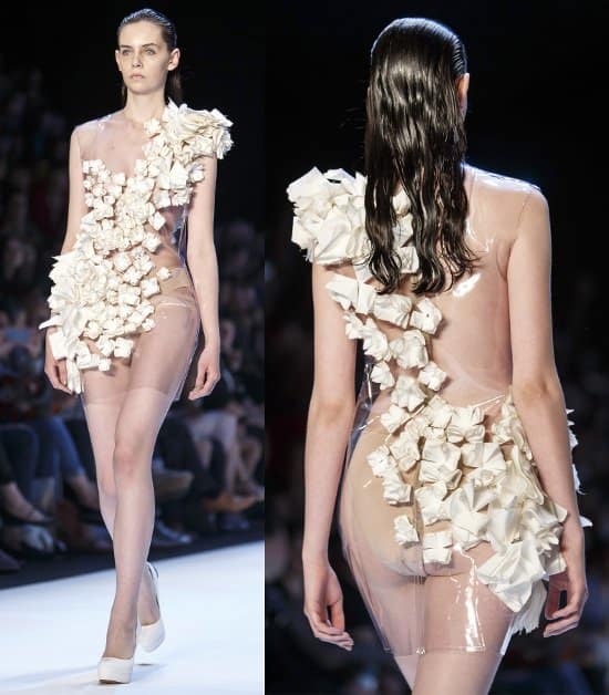 A transparent dress with f</em><em>olded fabric rosettes forming a gorgeous sash