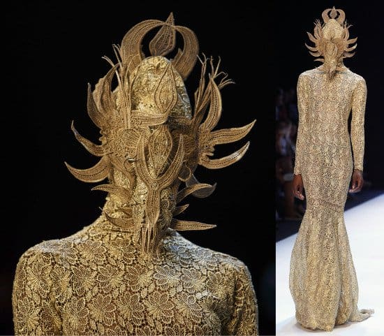 The ensemble of the show — an</em><em> exquisitely detailed figure-hugging dress paired with a mask with woven extensions