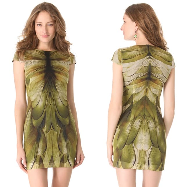 A green flattering cap-sleeve dress from Alexander McQueen, printed in a clever camouflage of large oversized wings
