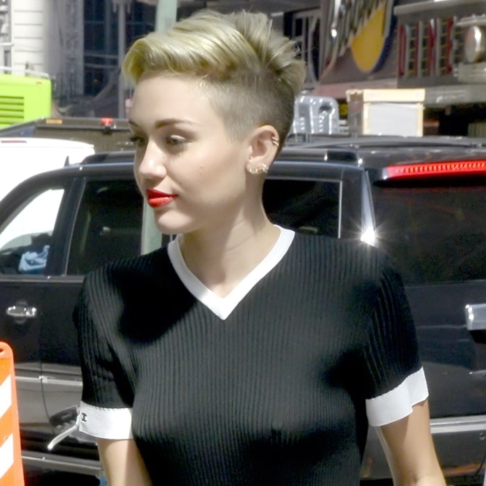 Miley Cyrus reveals her nipples in a racy mesh bralette top