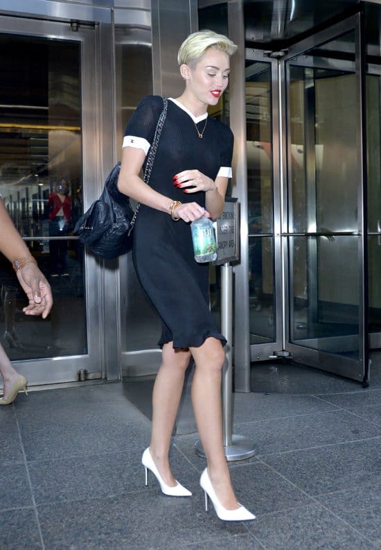 Miley Cyrus departing 'Good Morning America' wearing a black see-through dress