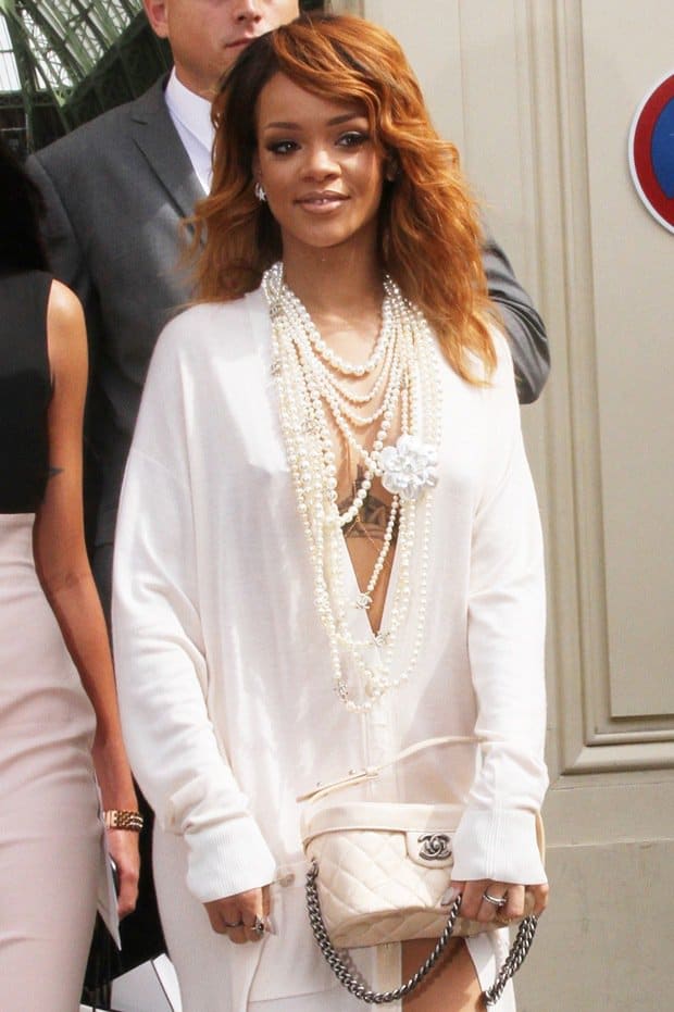 Rihanna wore her frock unbuttoned to the hilt to showcase lots of cleavage