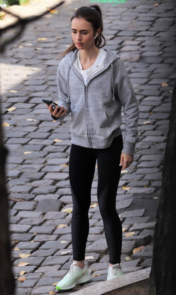 Actress Lily Collins is seen on the set of 'Emily in Paris' on August 19, 2019, in Paris, France