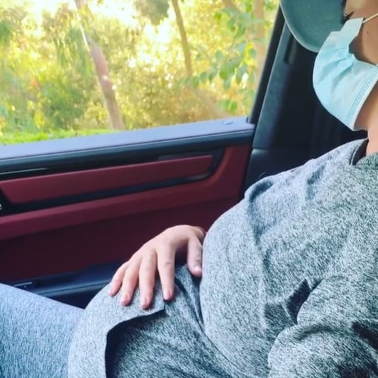 Pregnant Katy Perry wearing sweatpants and a hoodie by Outdoor Voices