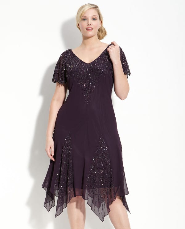 Dramatic beading highlights the fluid silhouette of a sheer chiffon dress with a double V-neckline, short flutter sleeves and diamond-shaped godet insets around the hem