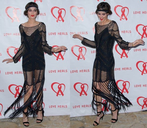 Nicole Trunfio pulling off the flapper look with a beaded black gown with fringed ends
