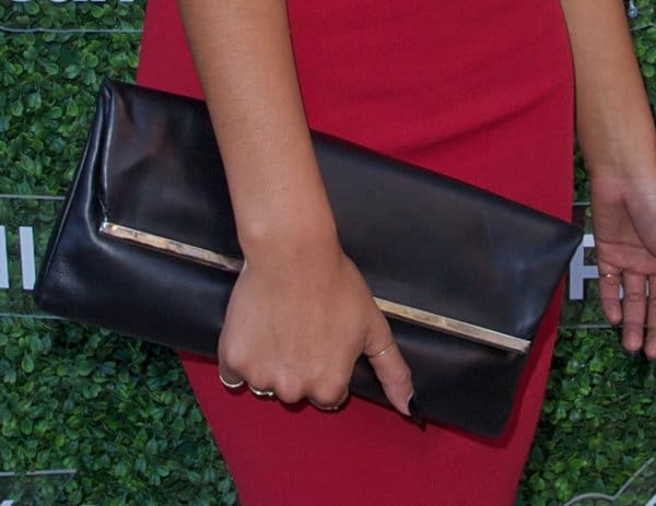 Chanel Iman carrying a Michael Kors Taylor clutch