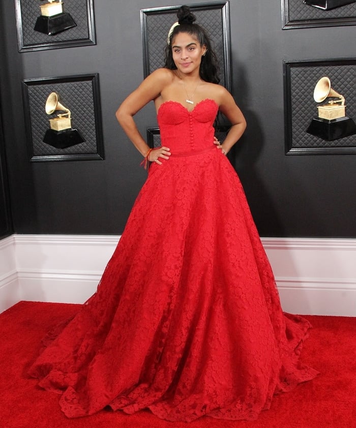 Jessie Reyez accessorized her red strapless Romona Keveža dress with jewelry by Mémoire and David Yurman at the 62nd Annual Grammy Awards