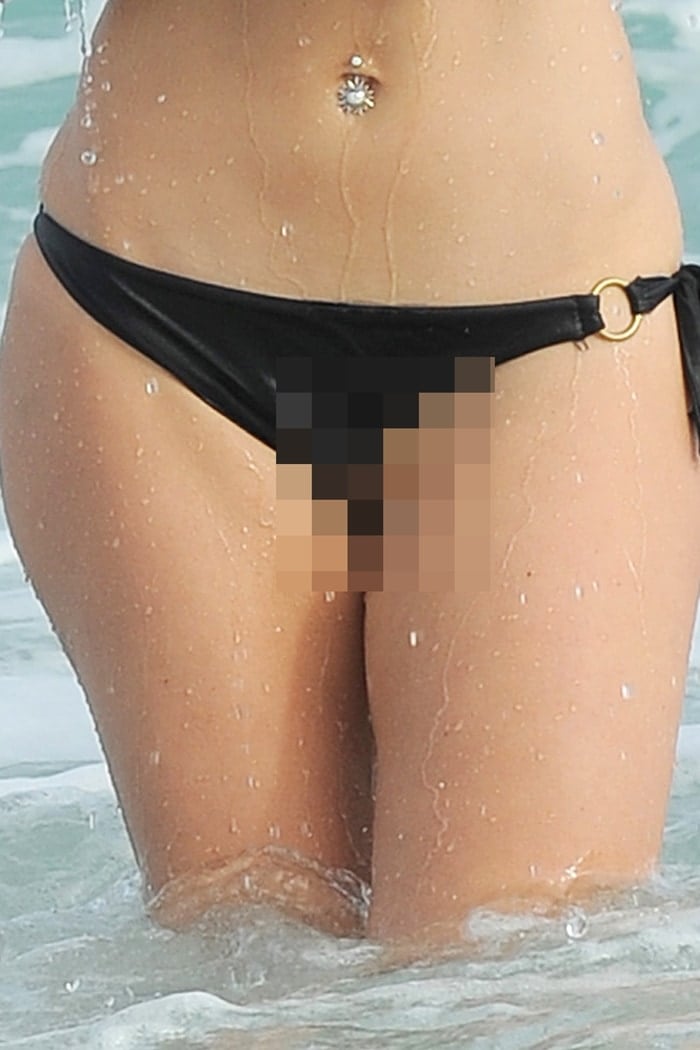Maria Menounos had a bikini wardrobe malfunction and revealed her shaved vagina when emerging from the ocean