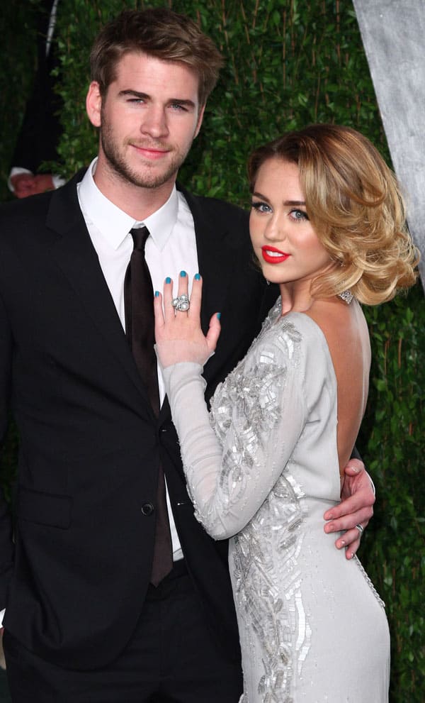Actor Liam Hemsworth and actress/singer Miley Cyrus arrive at the 2012 Vanity Fair Oscar Party