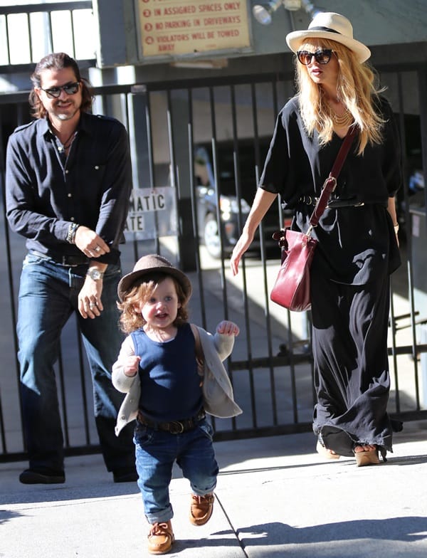Rachel Zoe appeared effortless and bohemian in her ensemble consisting of a flowing black maxi dress paired with a short-brimmed straw hat while out with her family for lunch