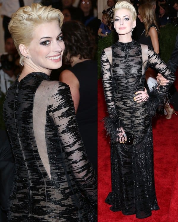 Anne Hathaway went braless in a black Valentino Couture embellished vintage dress