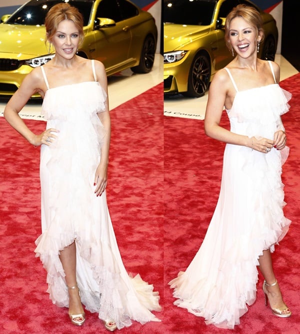 Kylie Minogue donned a white ruffle lace trim dress by Nina Ricci featuring a highly distinctive embellished design