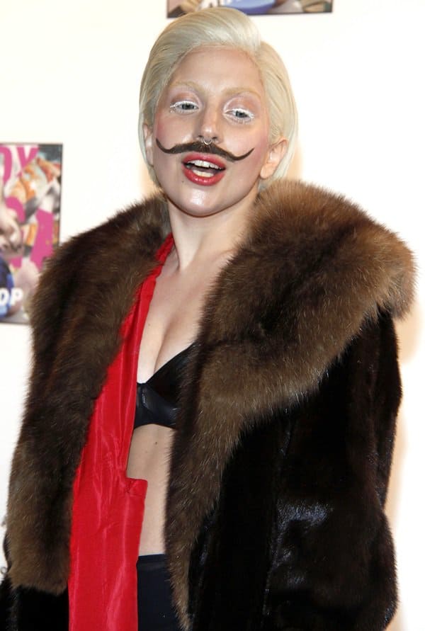 Lady Gaga wears an enormous fake mustache while promoting her new album (Artpop) at the famous Berghain club
