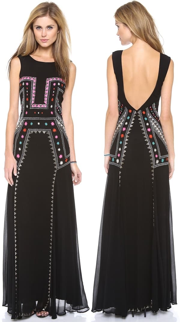 Geometric embroidery and beading frame the sheer bodice of this floor-length black dress