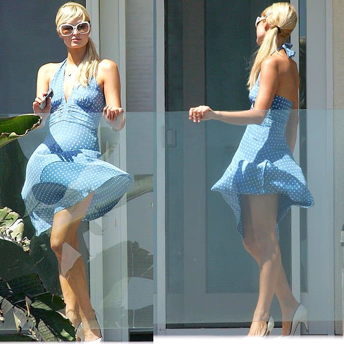 Paris Hilton looking out over the balcony of her beach house in Malibu, California on August 18, 2007