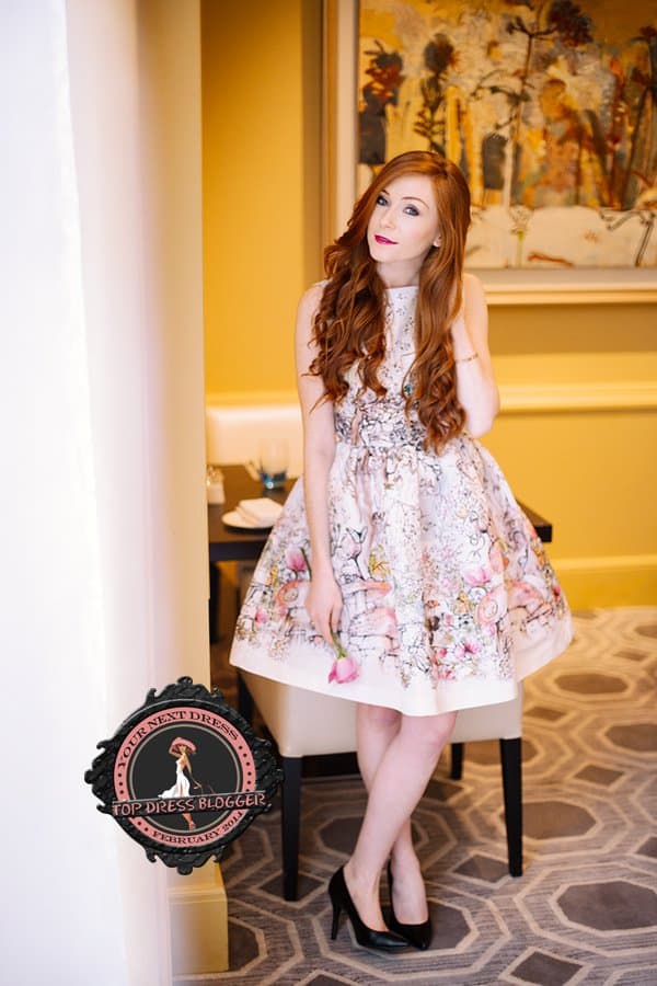 Erika goes formal in a floral flared dress and black pumps