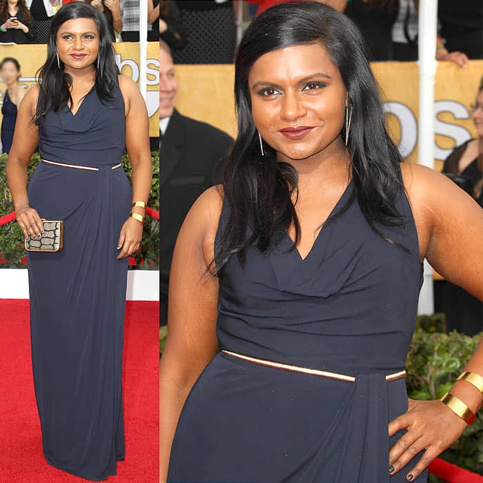 Mindy Kaling in a navy matte David Meister jersey gown with a gold belt, Jennifer Fisher earrings, and a Jerome C. Rousseau clutch at the 20th Annual Screen Actors Guild Awards