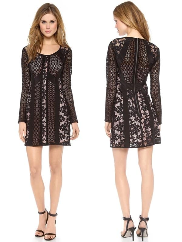 A tactile black dress composed of patterned lace panels