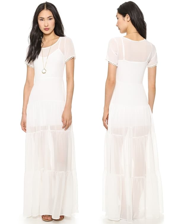 A tiered, ruffled hem lends fluid movement to a whimsical For Love and Lemons maxi dress
