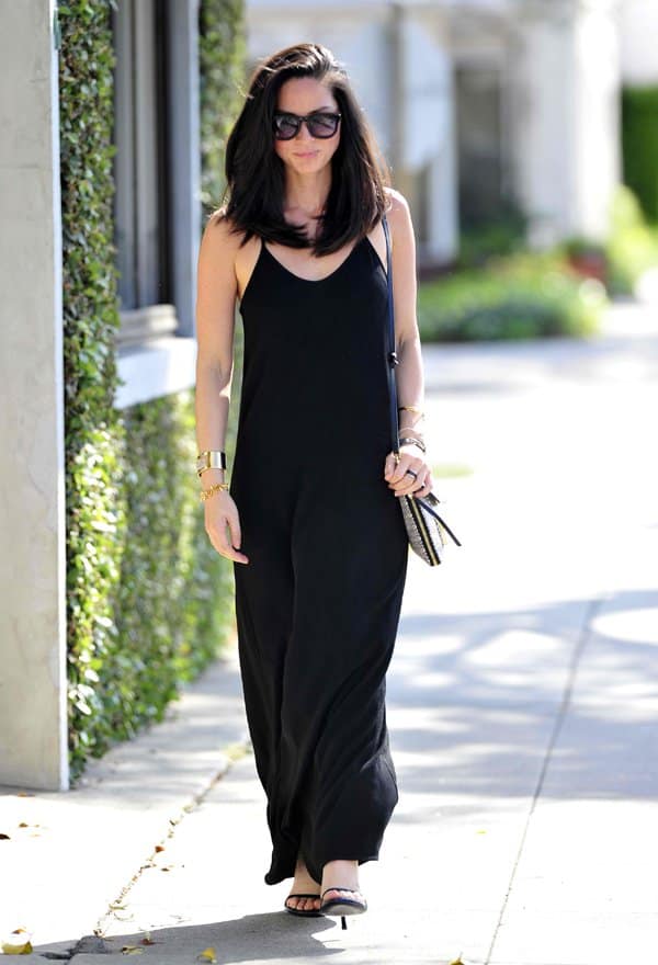 Olivia Munn styled her black maxi dress with Stuart Weitzman Nudist sandals