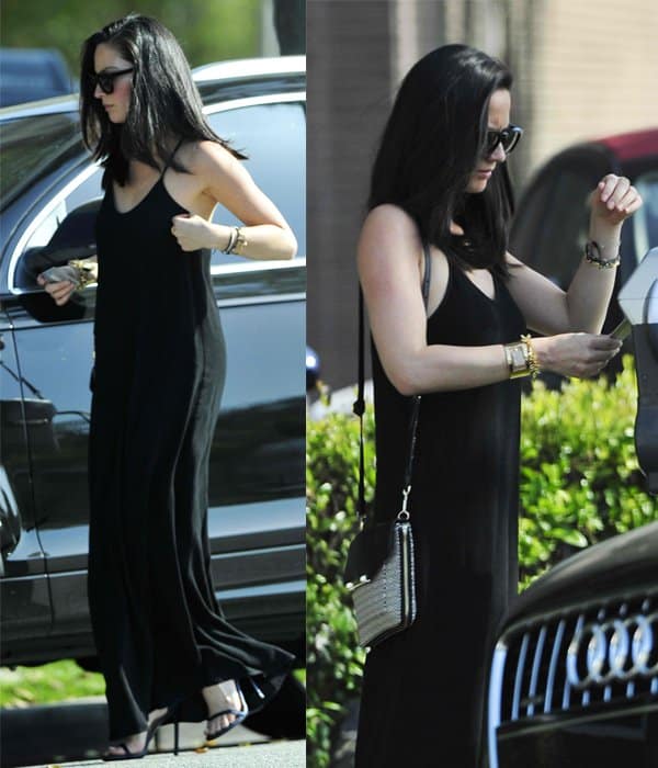 Olivia Munn wearing a black maxi dress in Beverly Hills
