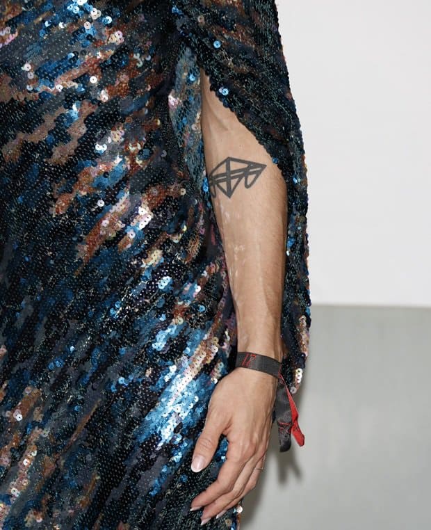 Conchita Wurst has a tattoo on her left forearm that is made up of the first initials of her mother, father, and brother