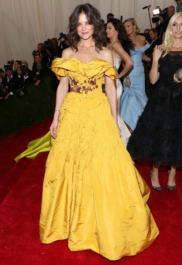 Katie Holmes wearing a mustard yellow Marchesa gown