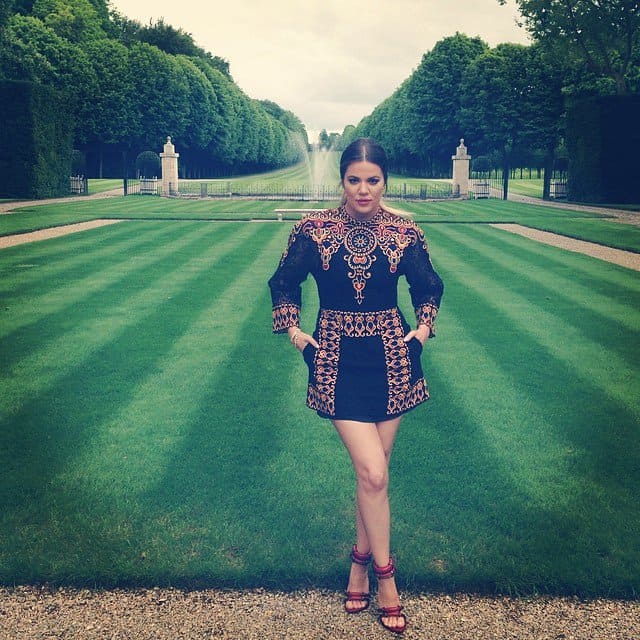 Khloe Kardashian posing in front of the Chateau de Wideville grounds