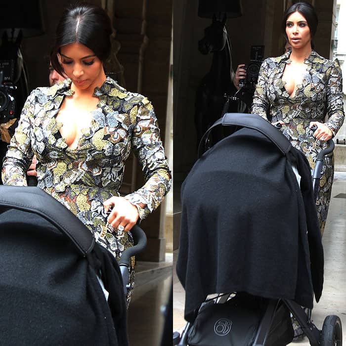 Kim Kardashian making sure her dress is in place before facing the paparazzi waiting for her outside her Parisian residence